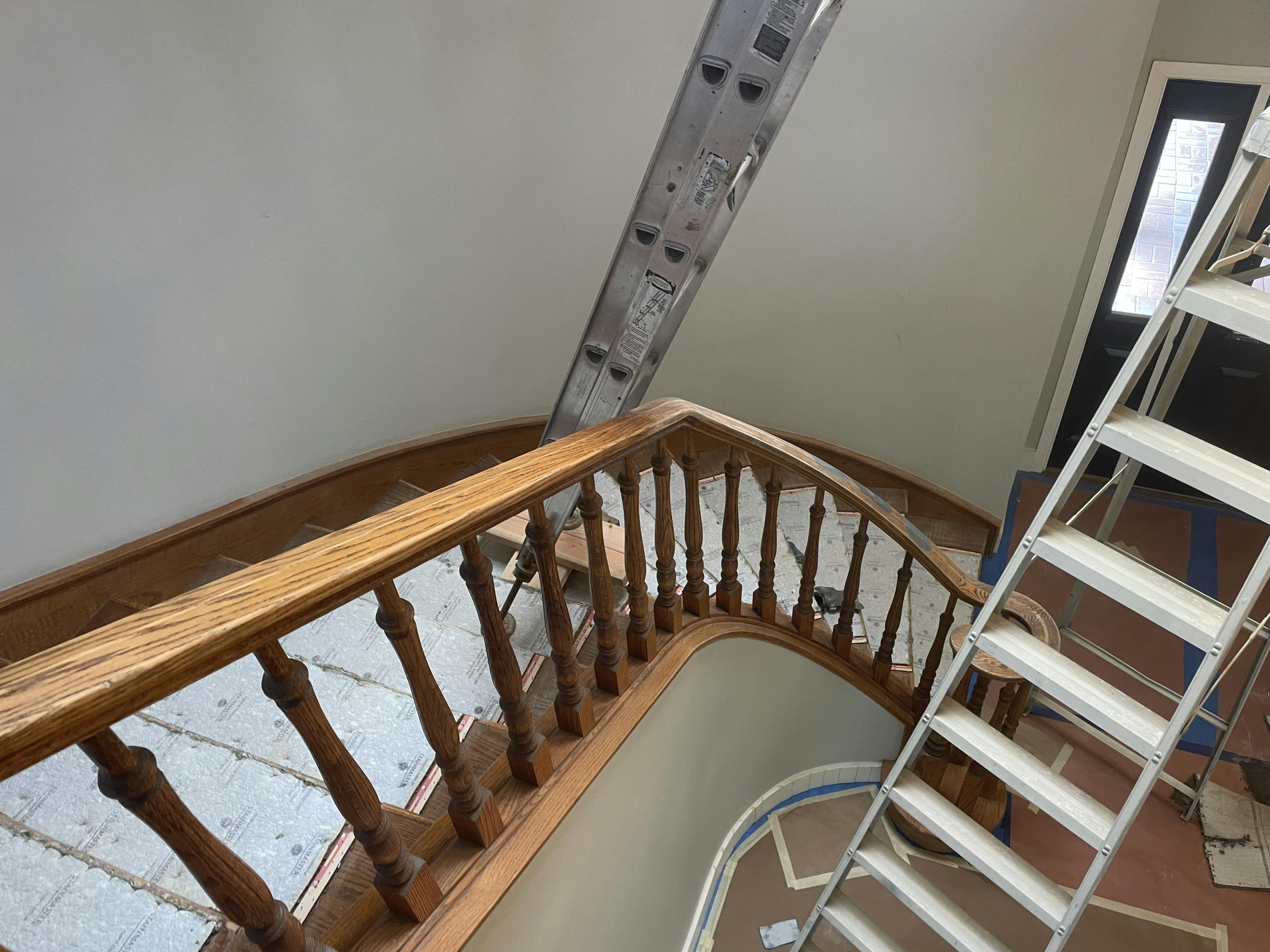 Before image by extreme painting for Top-down view of stairwell repair.