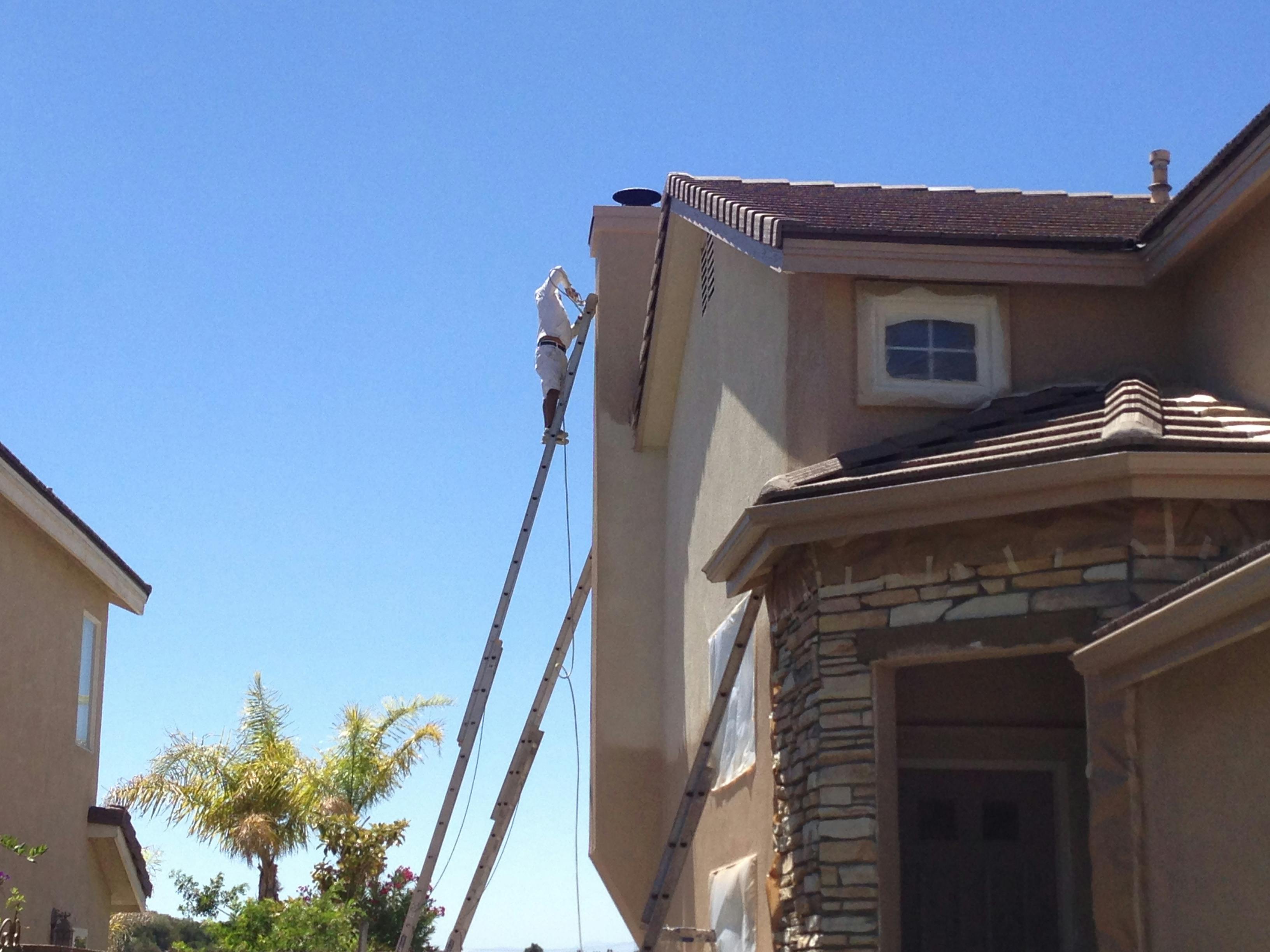 Before image by extreme painting for Contractors working on chimney repaint, exterior job.