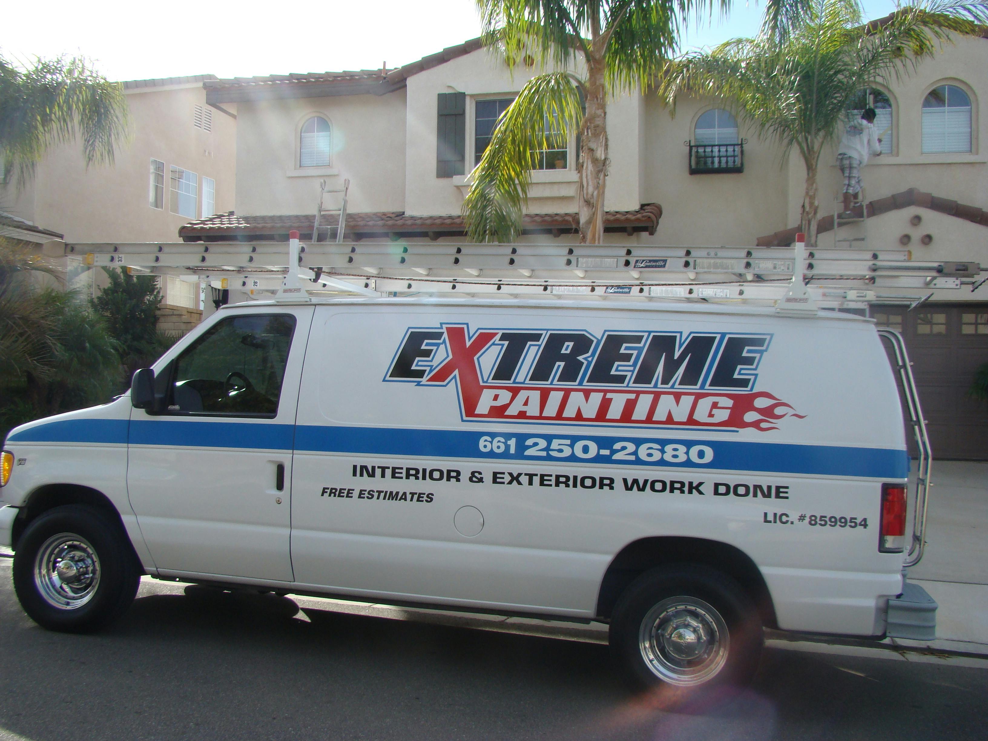 Before image by extreme painting for Company van outside one of our completed projects.